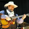 Jim is known for his great smile!  Here he's playing at a favorite venue, the Pretty Prairie Civic Theatre.